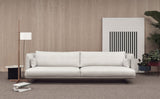Sofá Serene con base suspendida y brazos altos en un salón Fotografía de ambiente de Joquer.