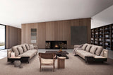 Dos sofás Silence con patas simples y módulo auxiliar lateral, en salón con chimenea. Fotografía de ambiente de Joquer.